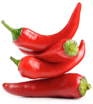 flera chilifrukter staplade pa varandra mot en vit bakgrund flera chilifrukter staplade pa varandra mot en vit bakgrund