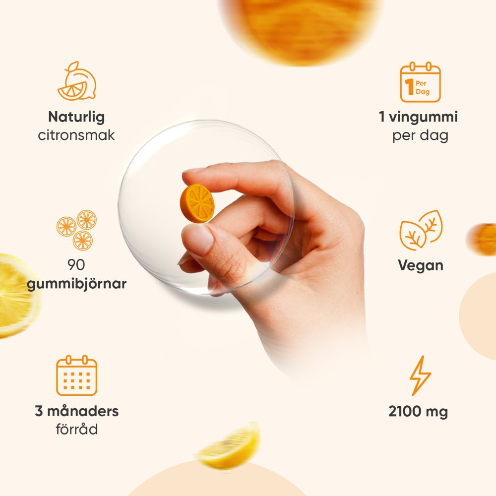 Gurkmeja Gummies i form av orange tuggtabletter, hand håller en skiva